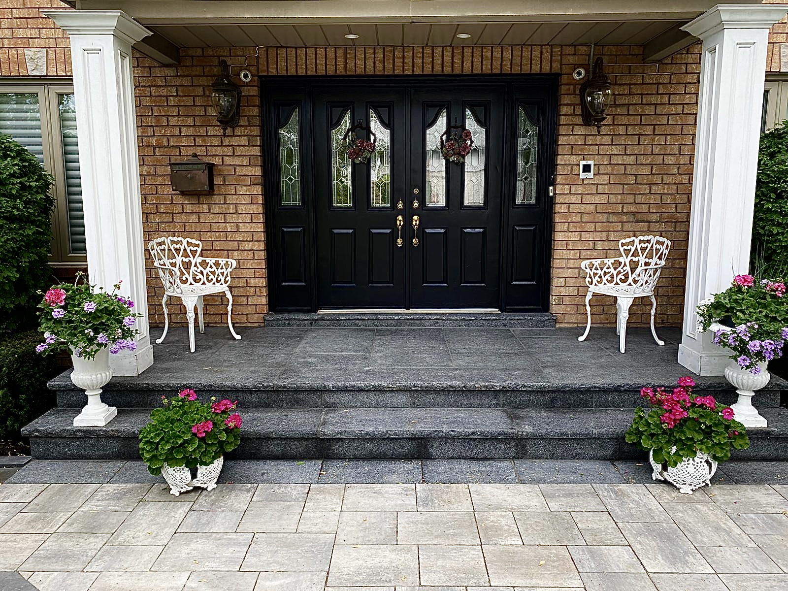 Porch-cover project with a defined front entry and protected landing area